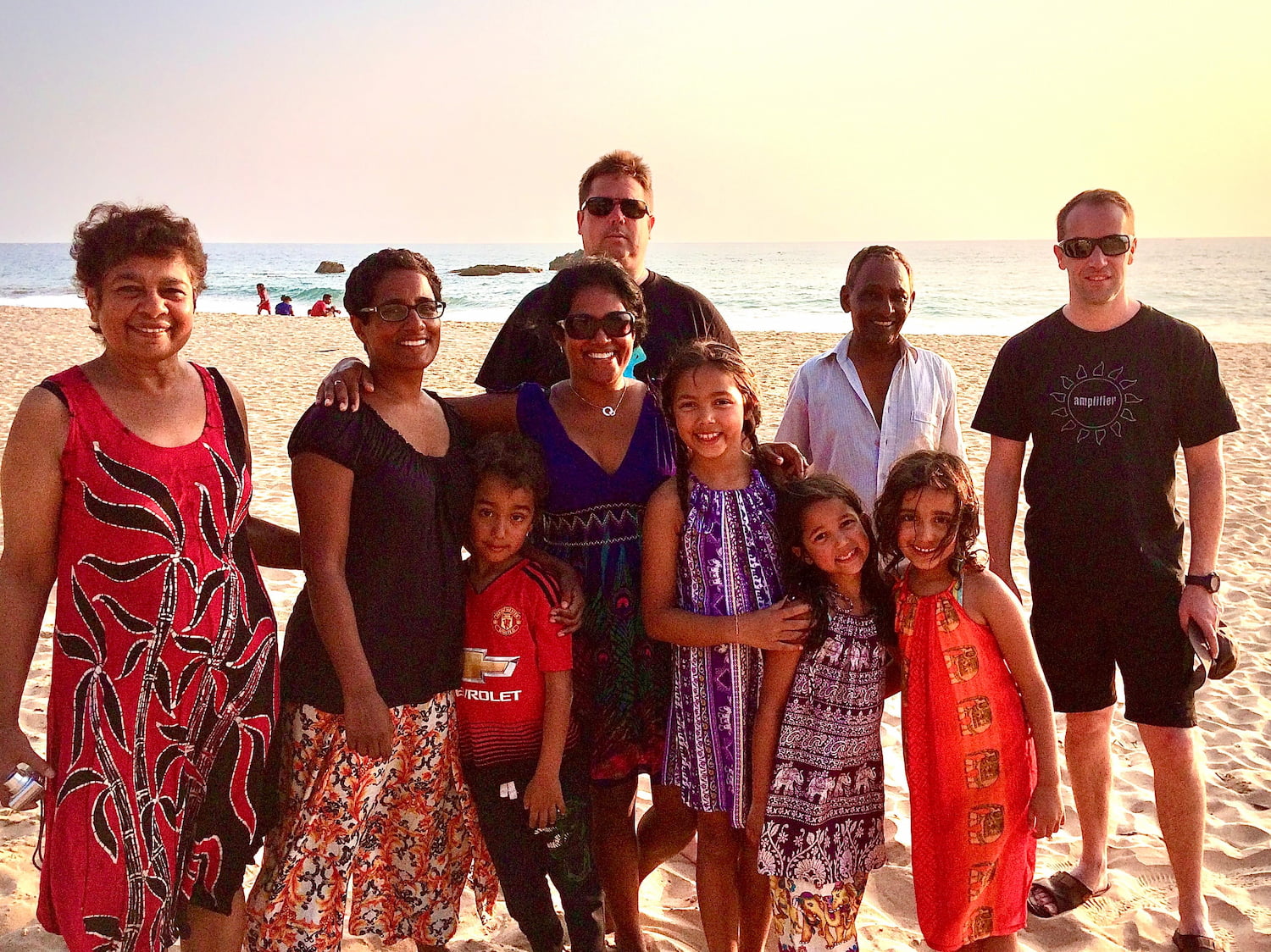 Van and family on beach in Sri Lanka